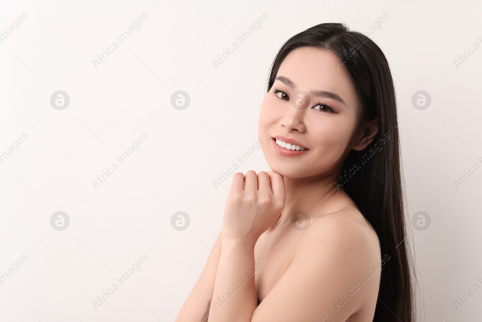 Photo of Portrait of beautiful woman on white background