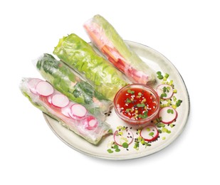 Delicious spring rolls served with sauce on white background