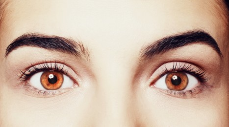 Image of Beautiful woman with captivating brown eyes, closeup