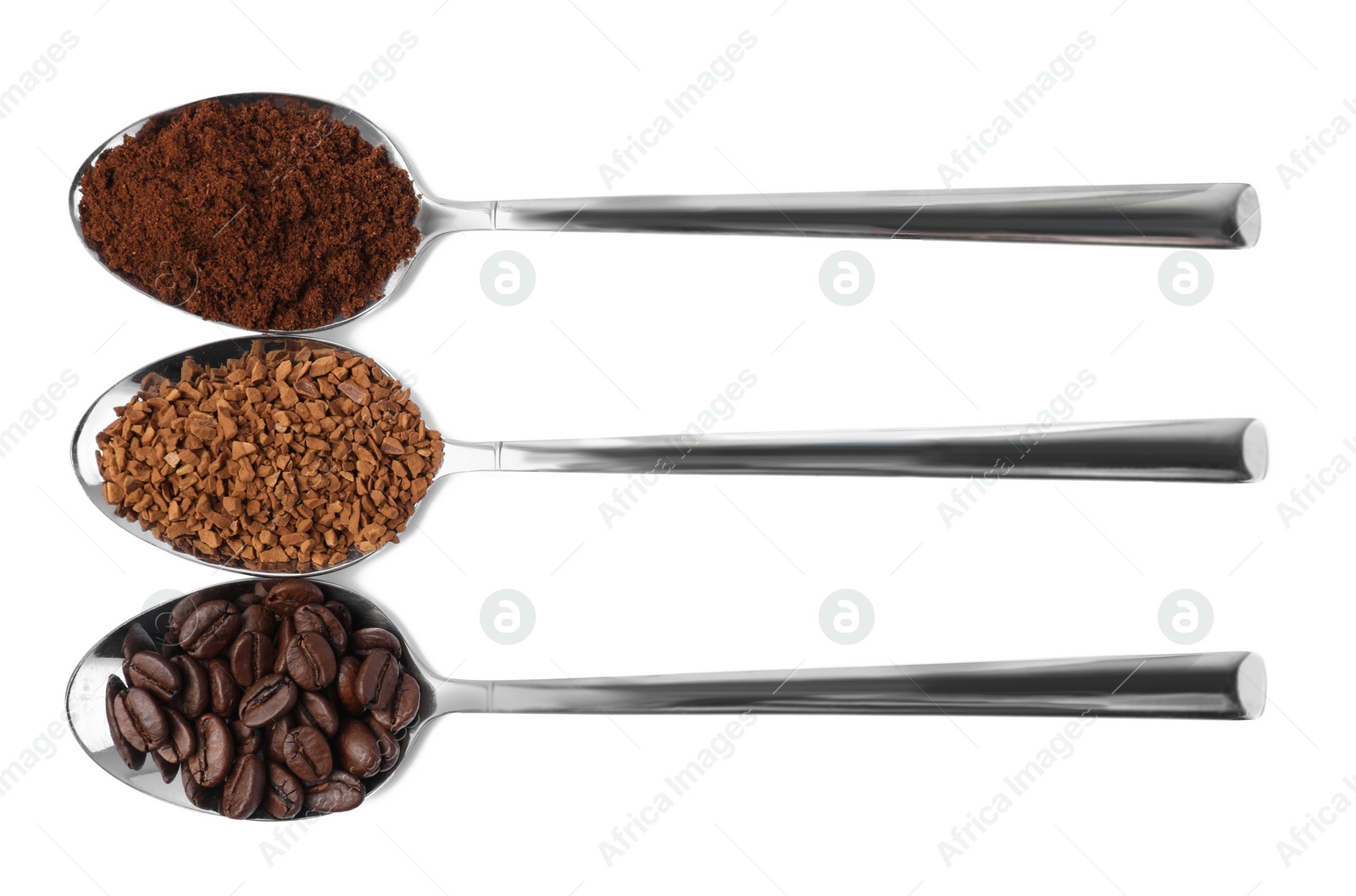 Photo of Spoons of beans, instant and ground coffee on white background, top view