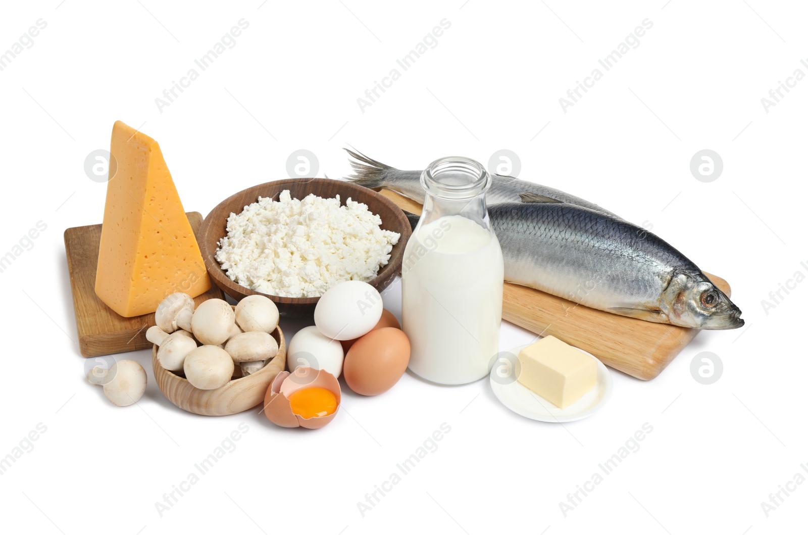 Photo of Fresh products rich in vitamin D on white background