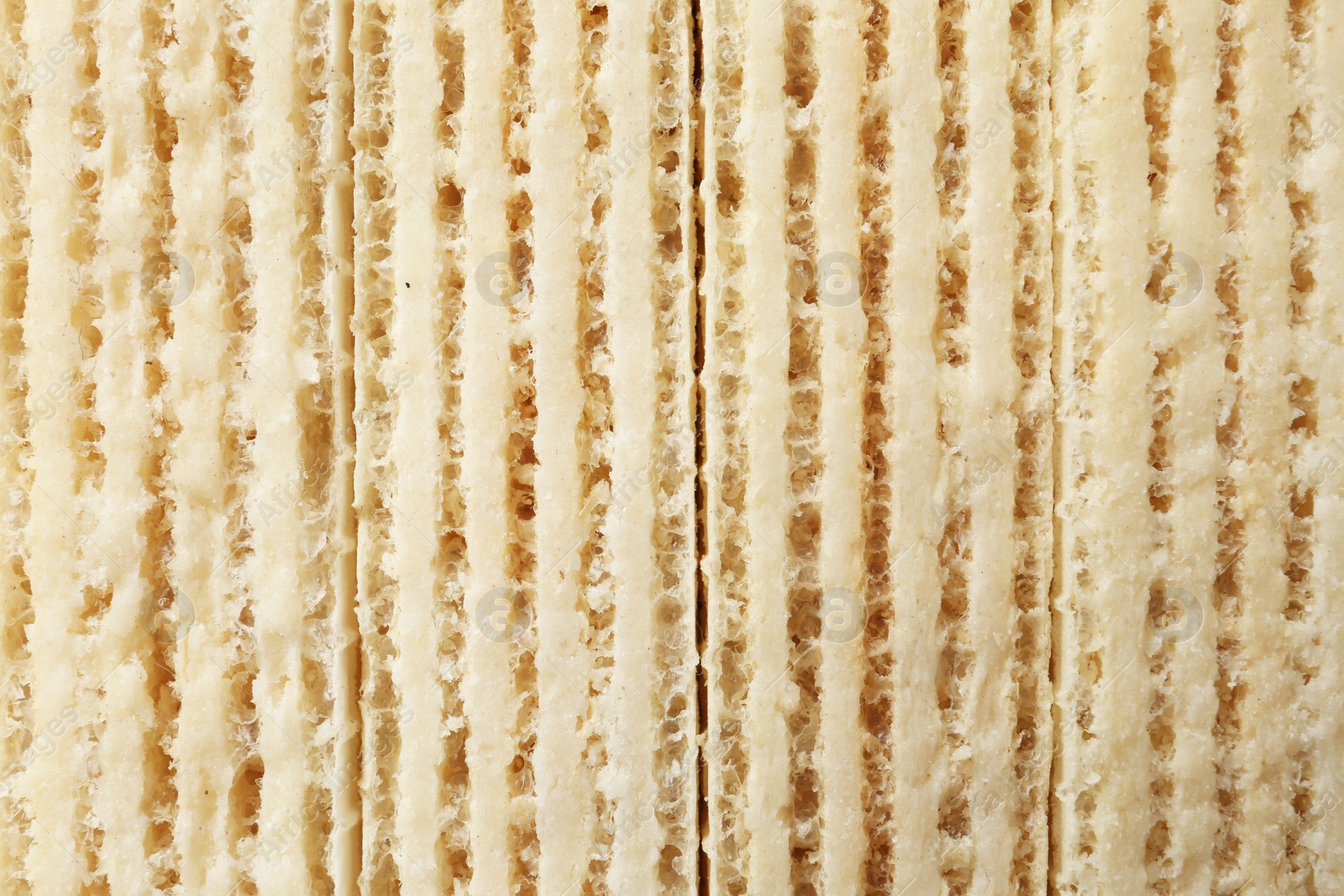 Photo of Closeup view of tasty wafer sticks as background. Sweet food