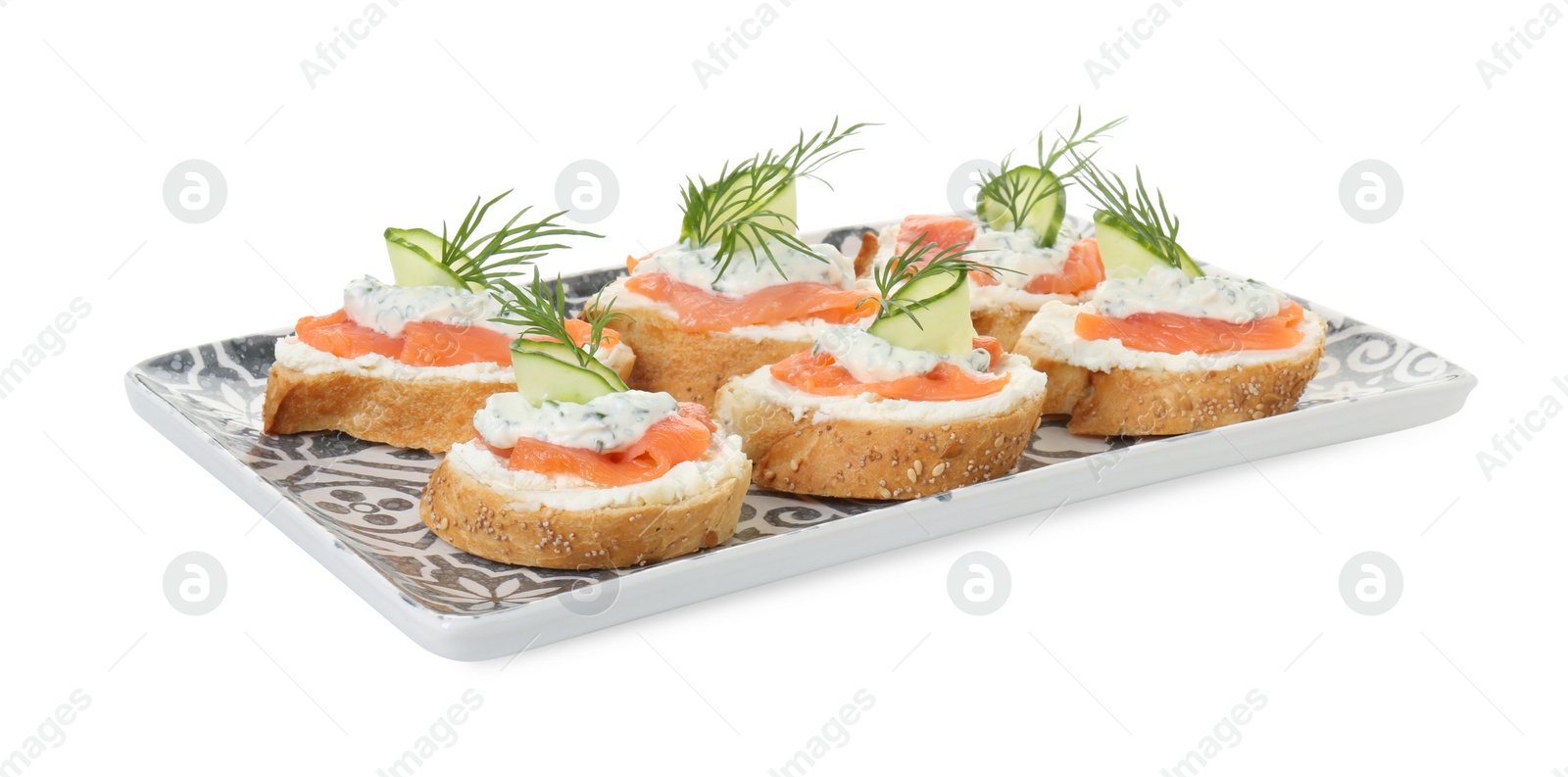 Photo of Tasty canapes with salmon, cucumber, cream cheese and dill isolated on white