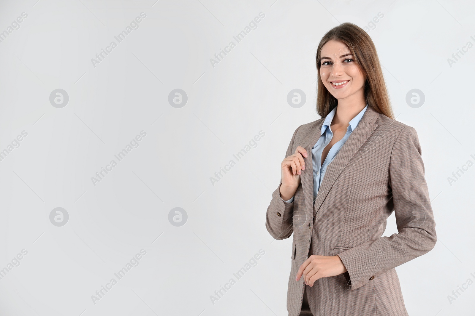 Photo of Portrait of beautiful young businesswoman on white background. Space for text