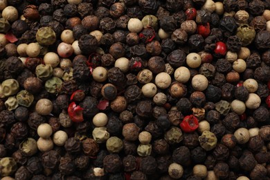 Aromatic spices. Different peppers as background, top view