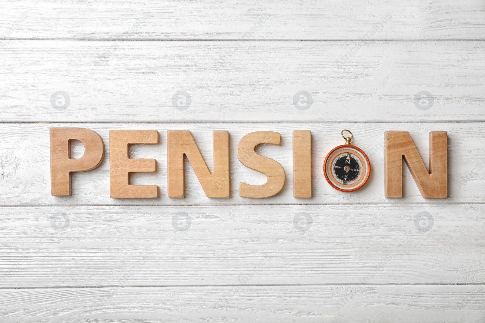 Photo of Flat lay composition with word PENSION and compass on wooden background