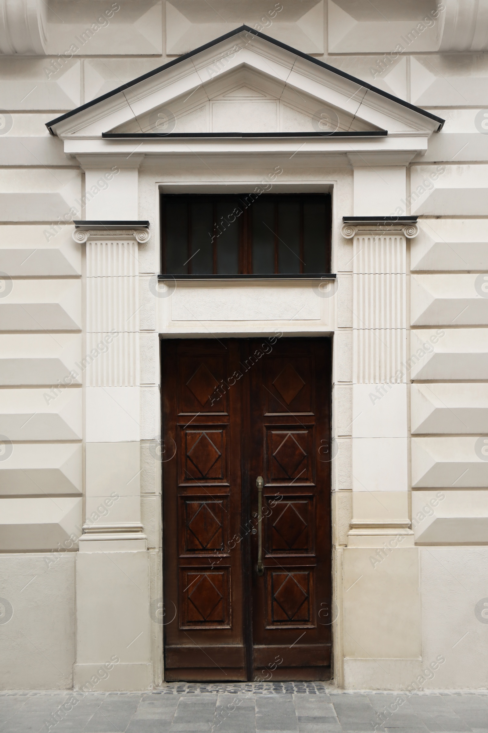 Photo of View of building with vintage wooden door. Exterior design