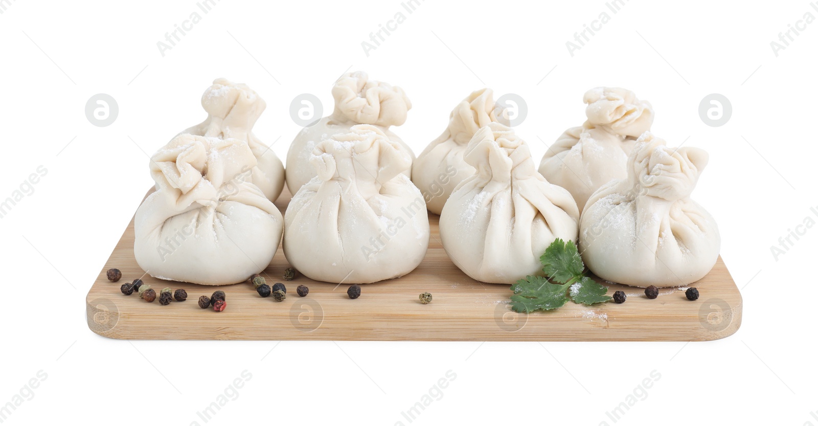 Photo of Uncooked khinkali (dumplings) and spices isolated on white. Georgian cuisine