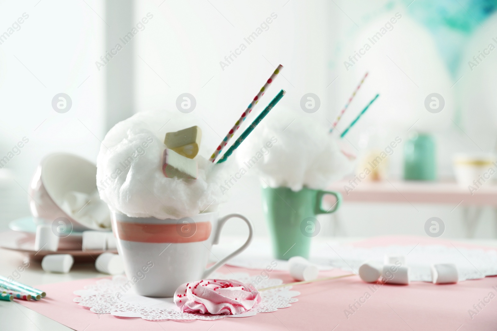 Photo of Cup of cotton candy dessert served on table, space for text