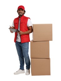 Photo of Happy young courier with stack of parcels and clipboard on white background