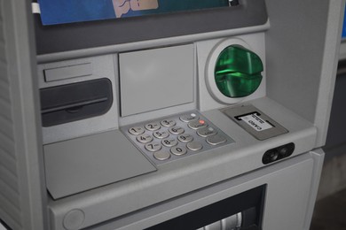 Photo of Closeup view of modern automated teller machine
