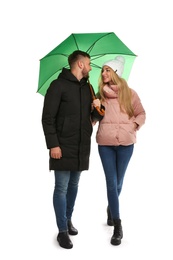 Full length portrait of beautiful couple with umbrella, isolated on white