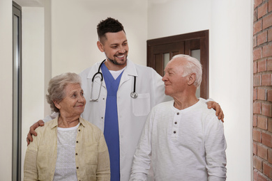 Photo of Doctor with senior patients at modern hospital