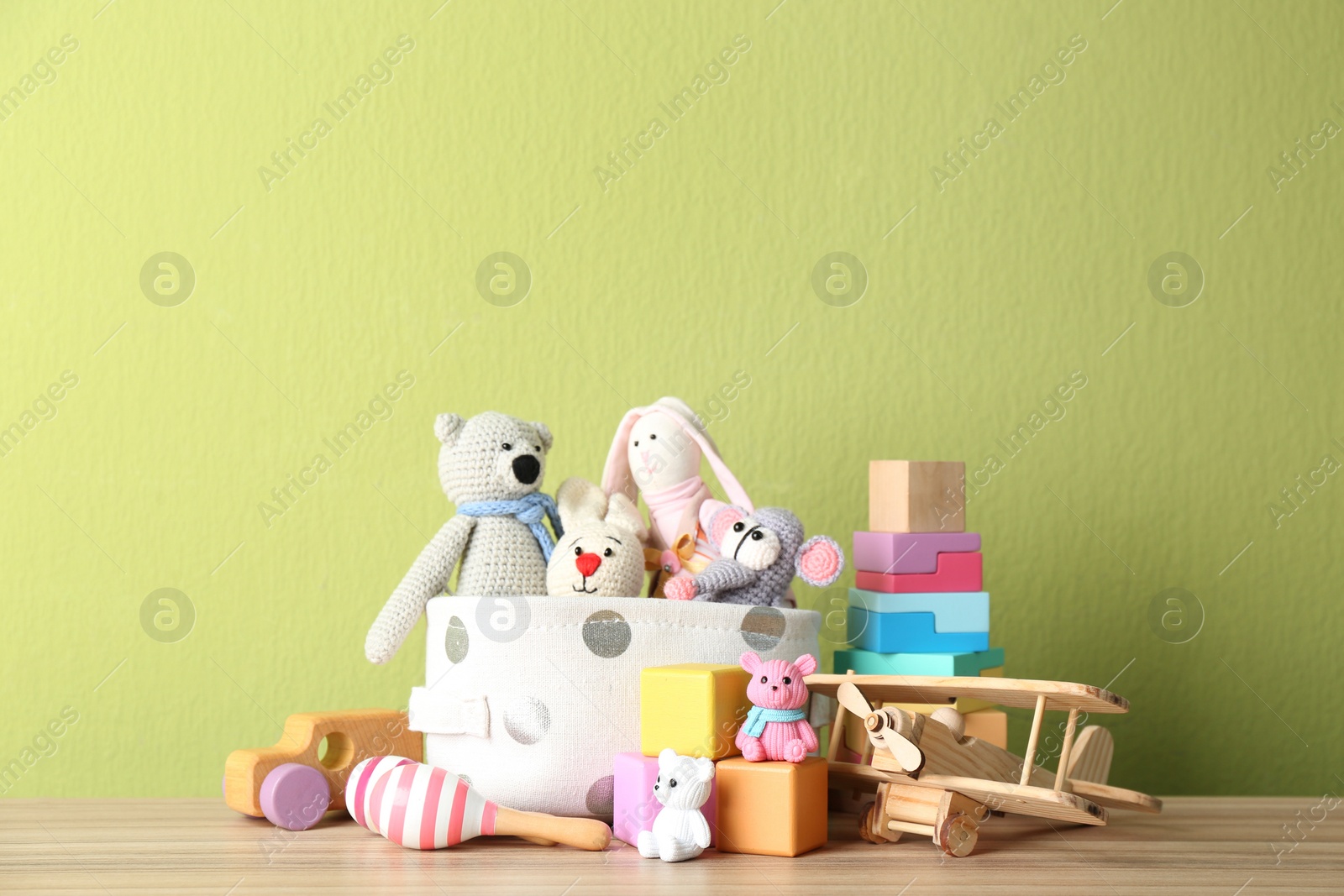 Photo of Set of different toys on wooden table