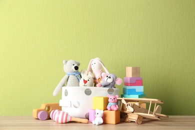 Set of different toys on wooden table