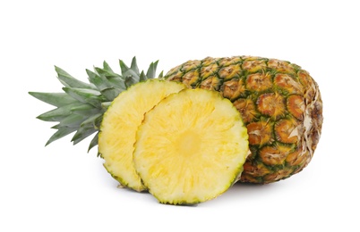 Photo of Cut and whole tasty pineapples on white background