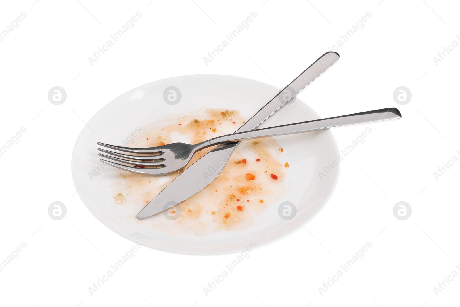 Photo of Dirty plate and cutlery on white background