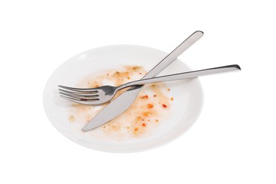 Dirty plate and cutlery on white background