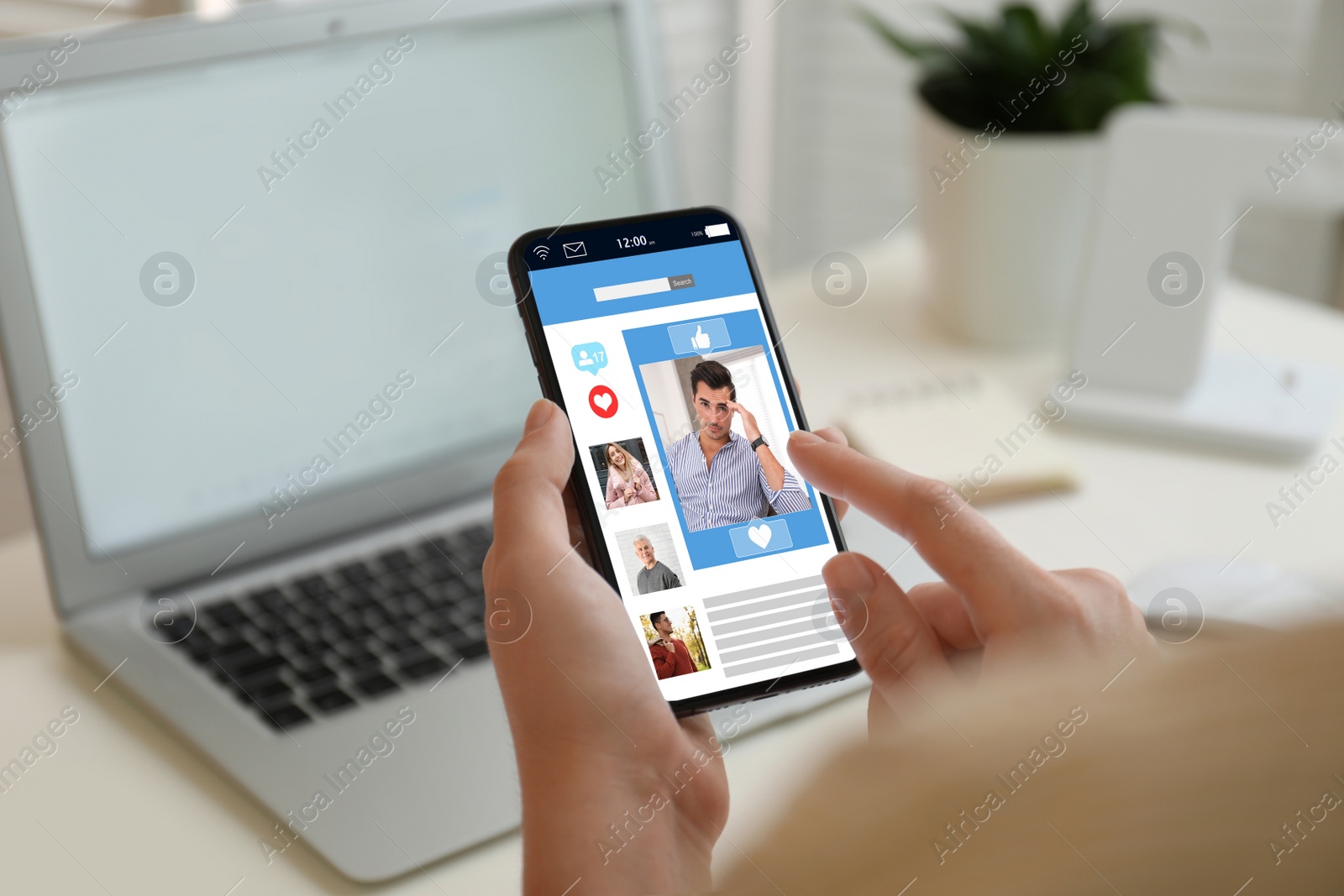 Image of Young woman visiting online dating site via smartphone indoors, closeup