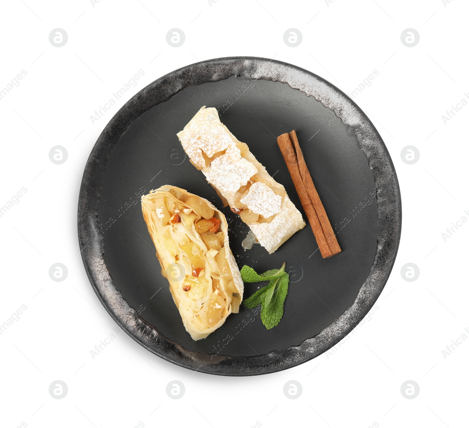 Photo of Pieces of delicious apple strudel with almonds, mint and cinnamon on white background, top view