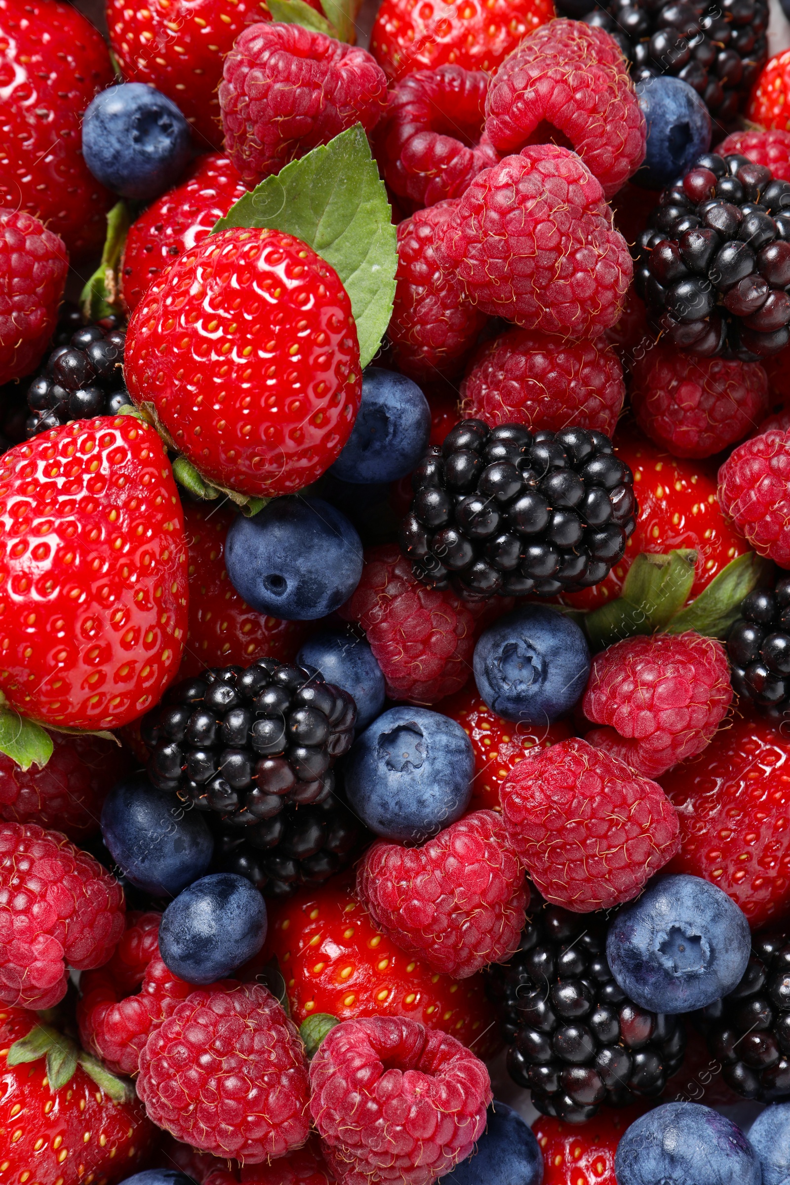 Photo of Different fresh ripe berries as background, top view