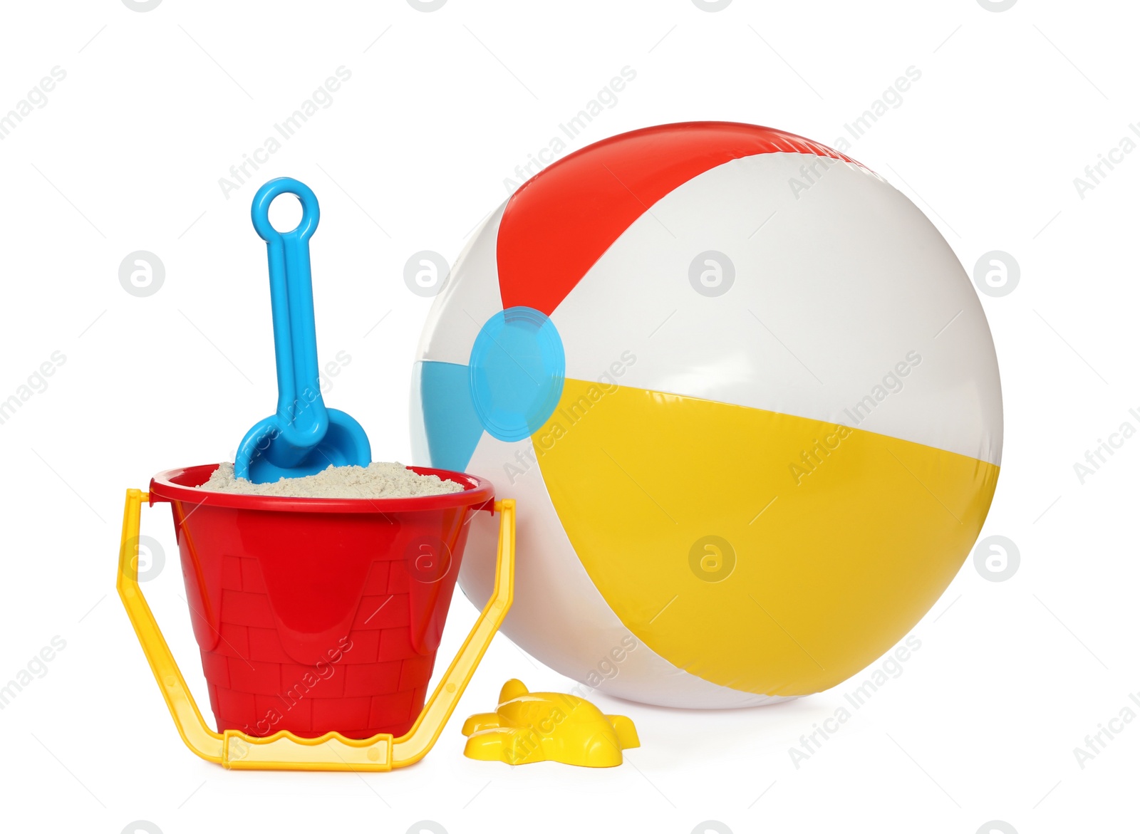 Photo of Inflatable colorful beach ball and child plastic toys on white background