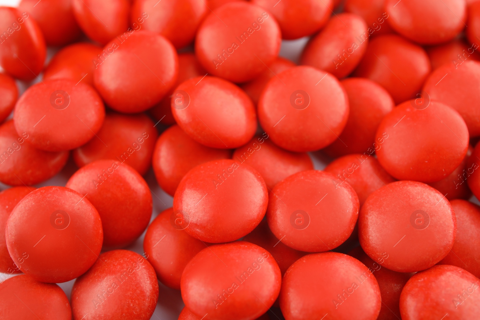 Photo of Many small colorful candies as background, closeup