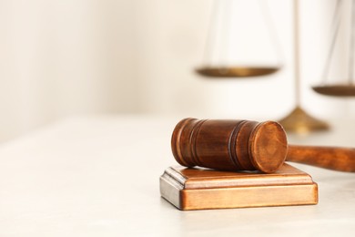 Photo of Law concept. Gavel on white table, closeup. Space for text