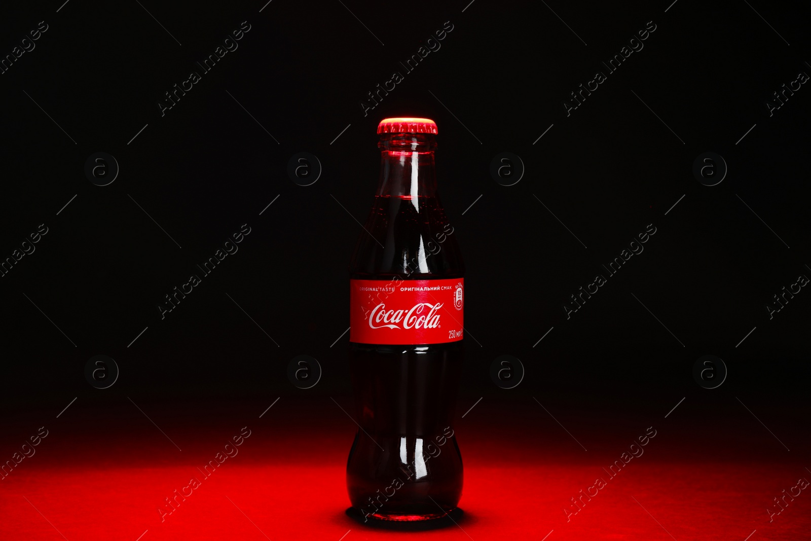 Photo of MYKOLAIV, UKRAINE - NOVEMBER 14, 2018: Bottle of Coca-Cola on dark background