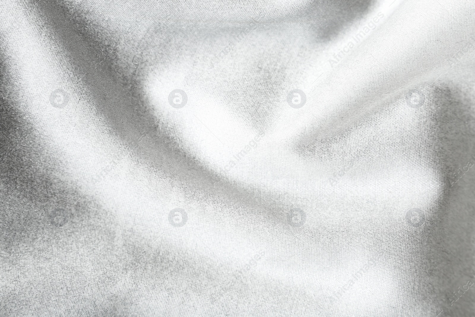 Photo of Texture of delicate white fabric as background, closeup