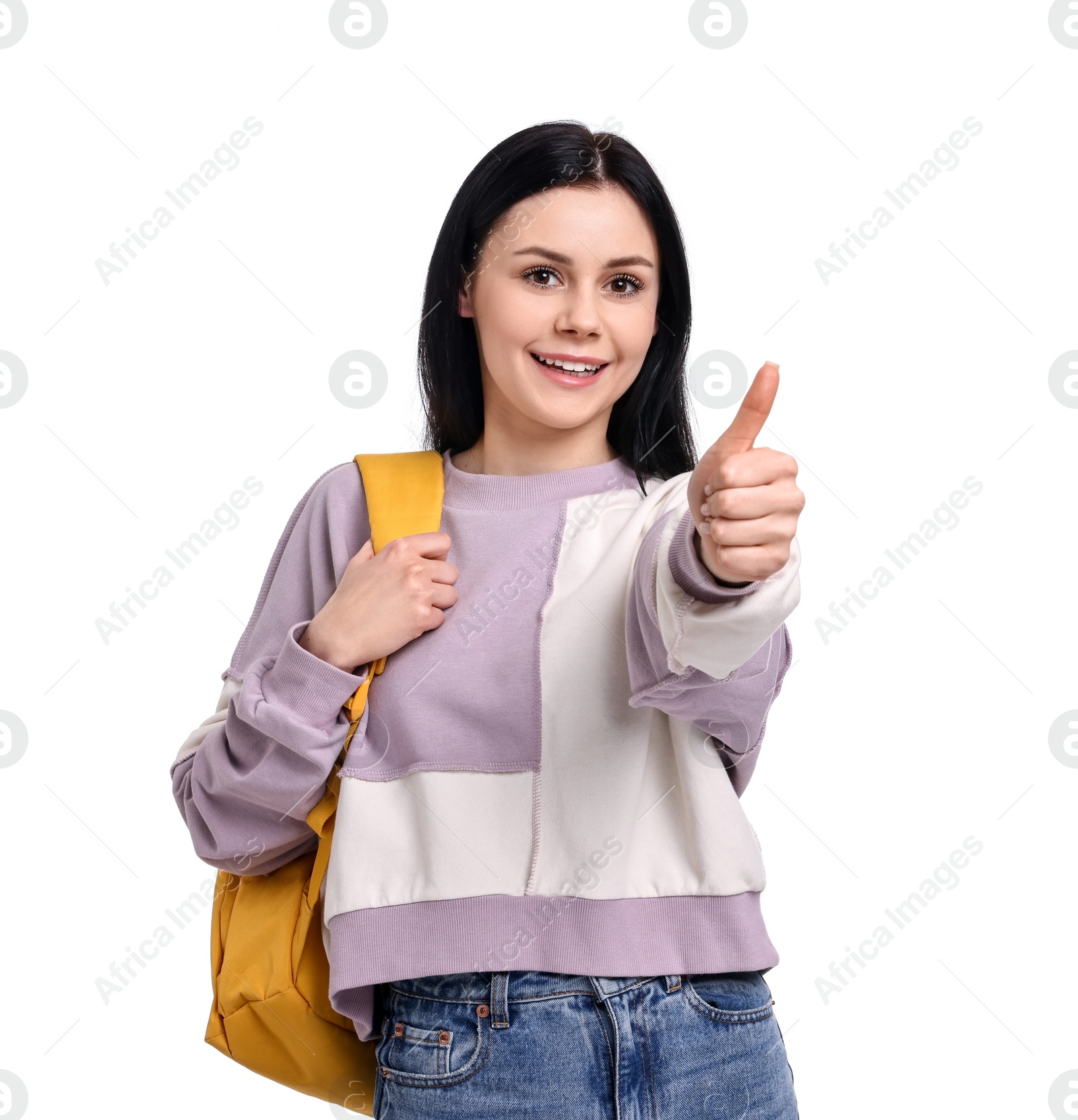 Photo of Smiling student with backpack showing thumb up on white background