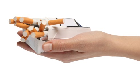 Photo of Stop smoking. Man holding pack with cigarettes on white background, closeup