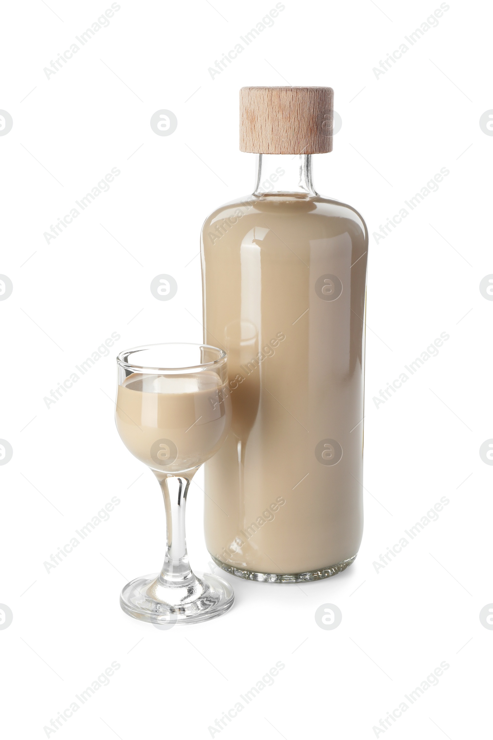 Photo of Bottle and glass of coffee cream liqueur isolated on white