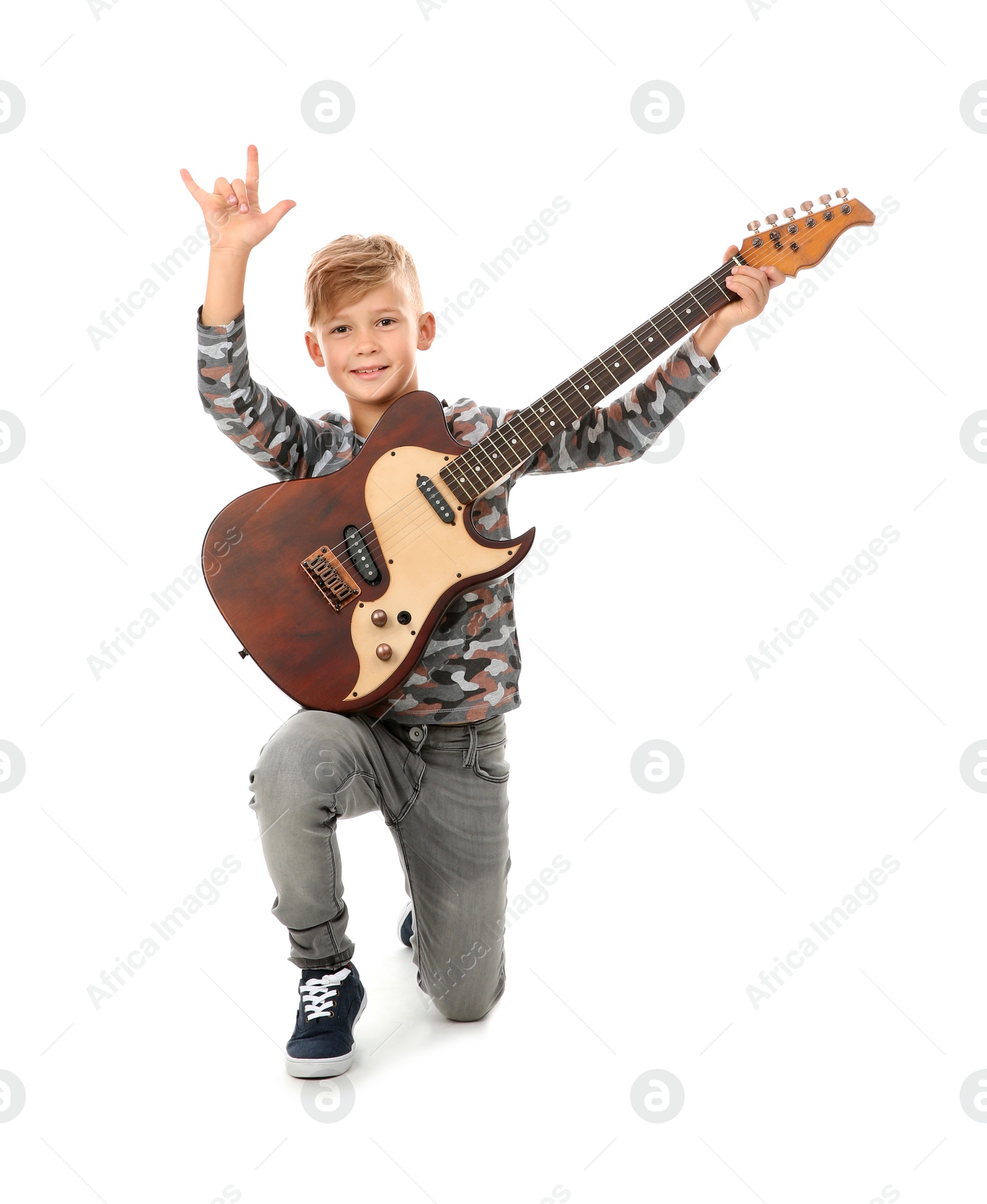 Photo of Cute little boy with guitar isolated on white