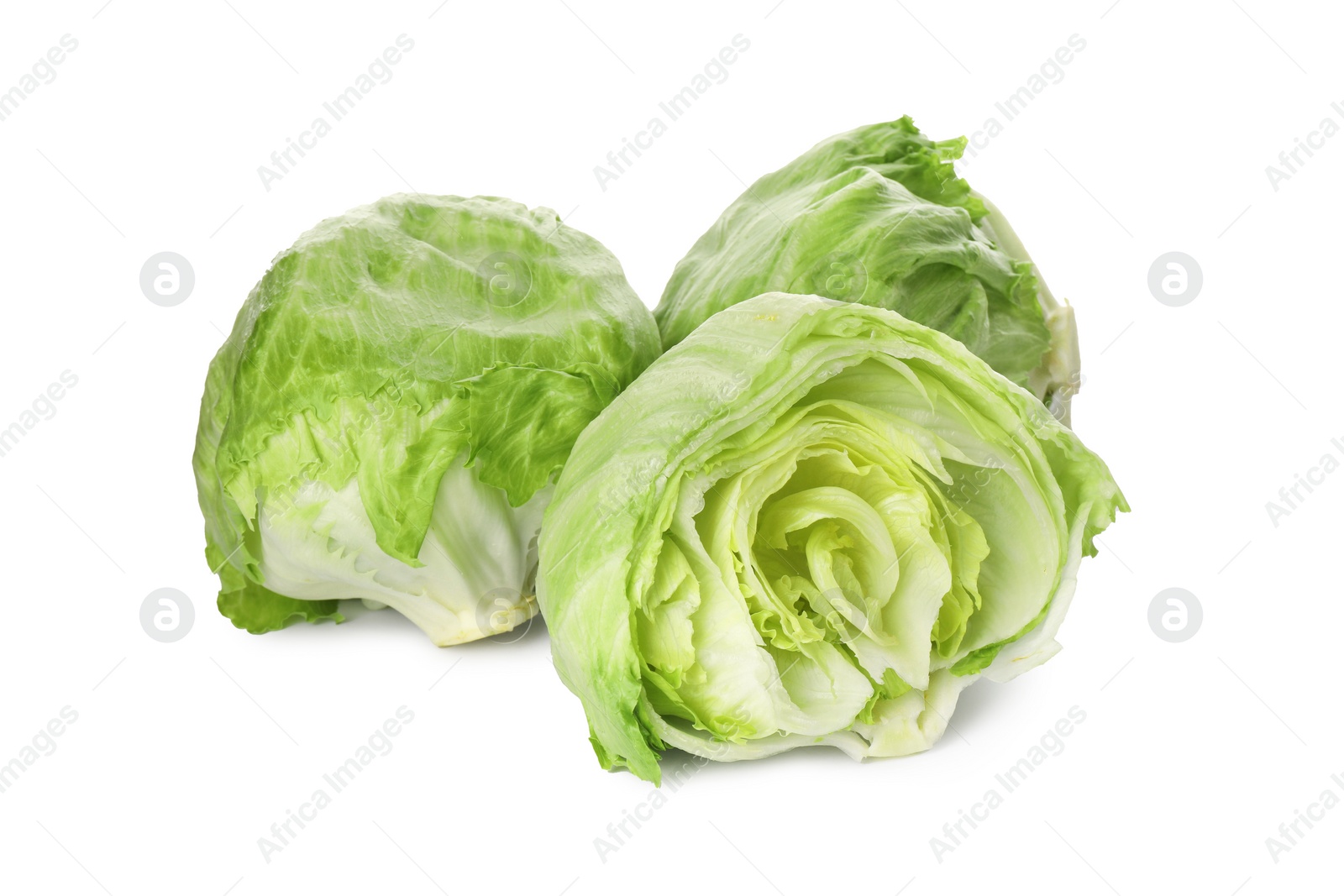 Photo of Whole and cut fresh green iceberg lettuces isolated on white