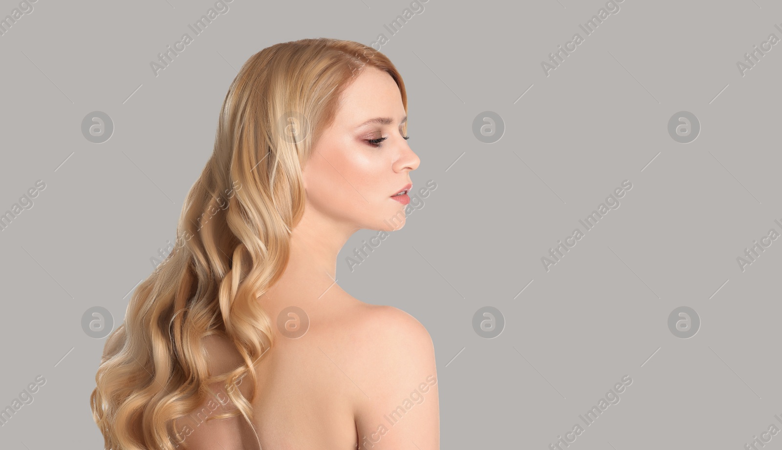 Image of Young woman with beautiful face on light background. Banner design