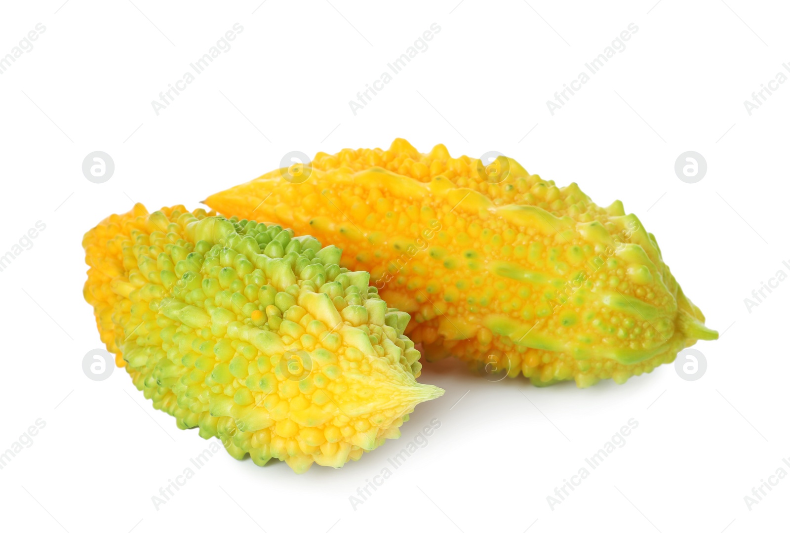 Photo of Fresh ripe bitter melons on white background