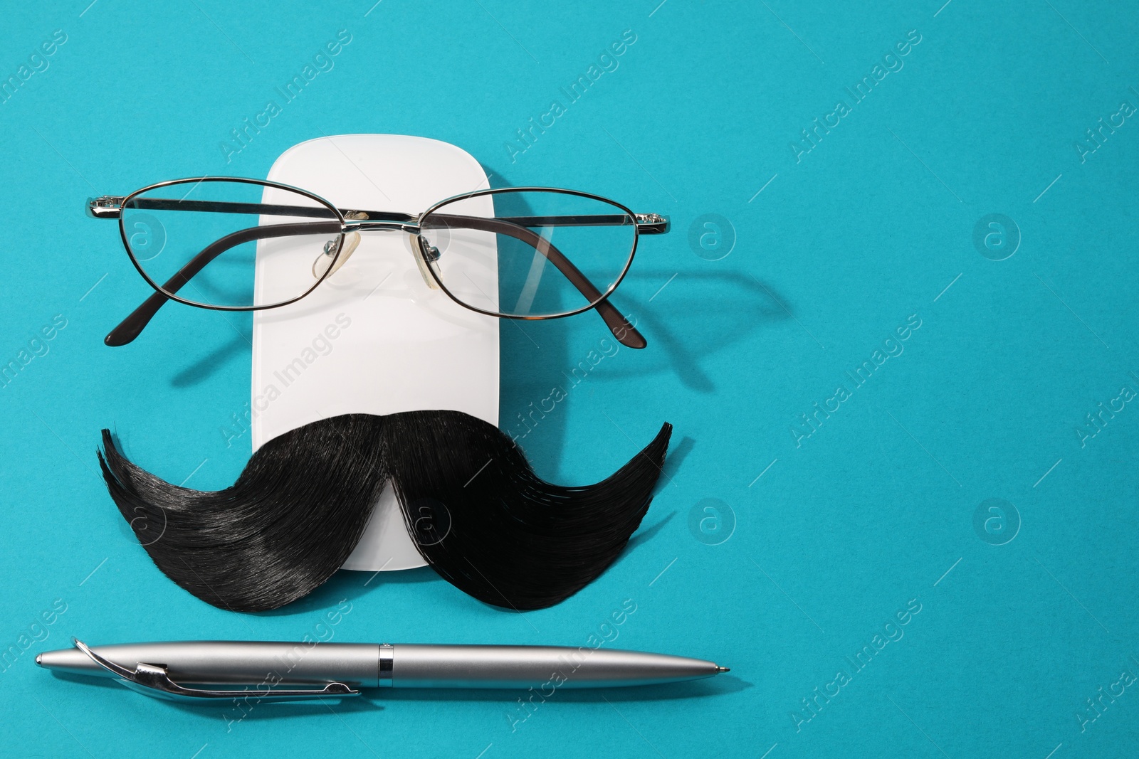 Photo of Flat lay composition with artificial moustache and glasses on light blue background, space for text