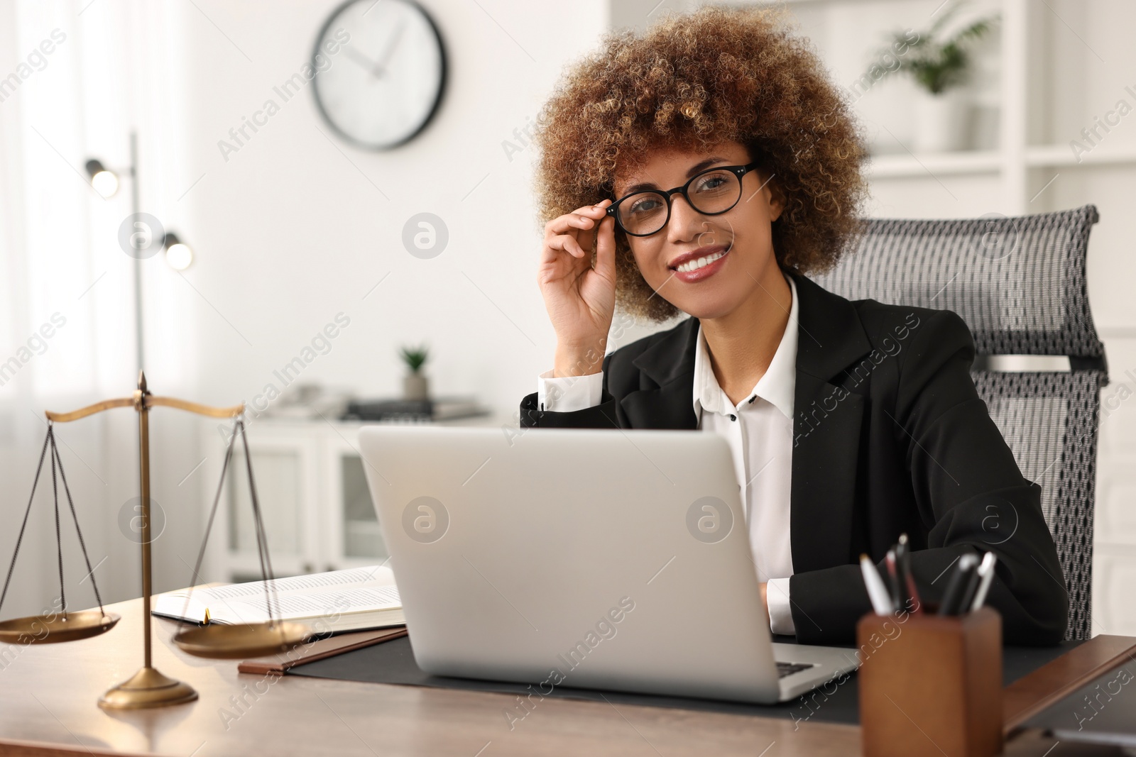 Photo of Notary using laptop at workplace in office