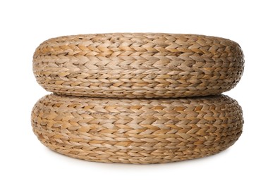 Photo of Two stylish wicker poufs on white background