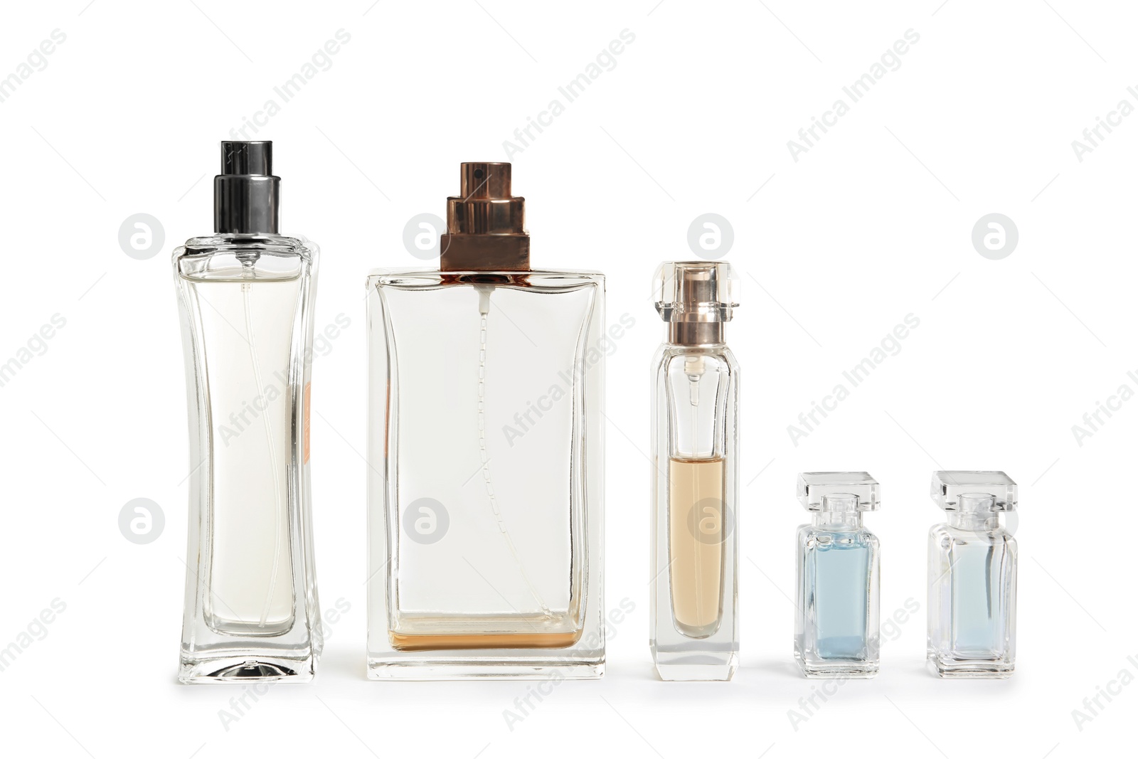 Photo of Different perfume bottles on white background