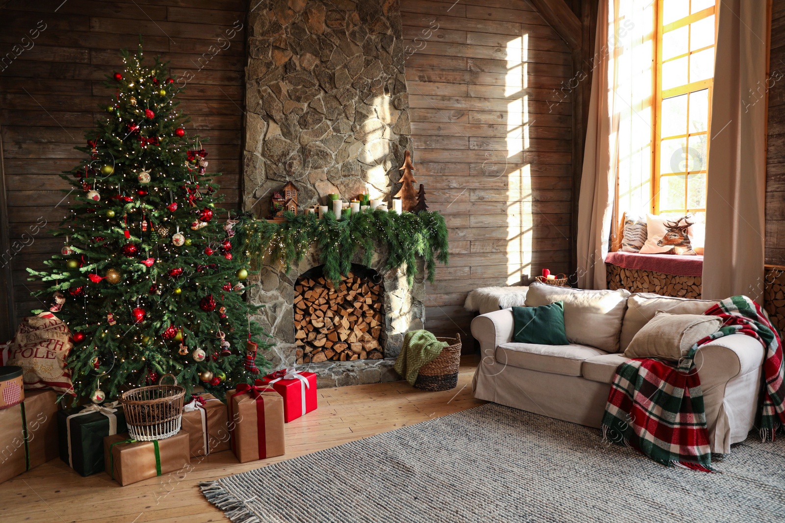 Photo of Festive interior with decorated Christmas tree and fireplace