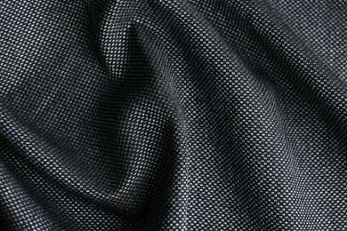 Texture of dark fabric as background, closeup