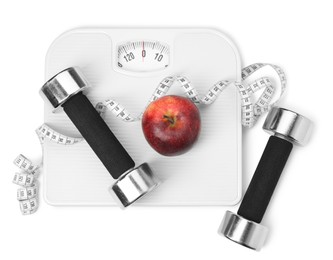 Photo of Scales, apple and measuring tape on white background, top view