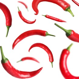 Image of Ripe red chili peppers flying on white background