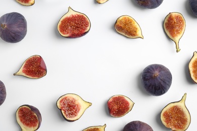 Photo of Delicious figs on white background, top view. Space for text