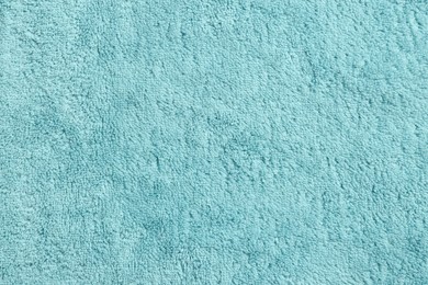 Photo of Soft light blue towel as background, top view
