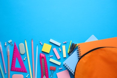 Photo of Different school stationery on light blue background, flat lay with space for text. Back to school