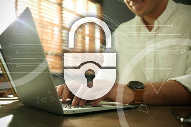 Image of Cyber security concept. Illustration of lock and man working with laptop at wooden table, closeup