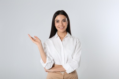 Photo of Portrait of young businesswoman on white background